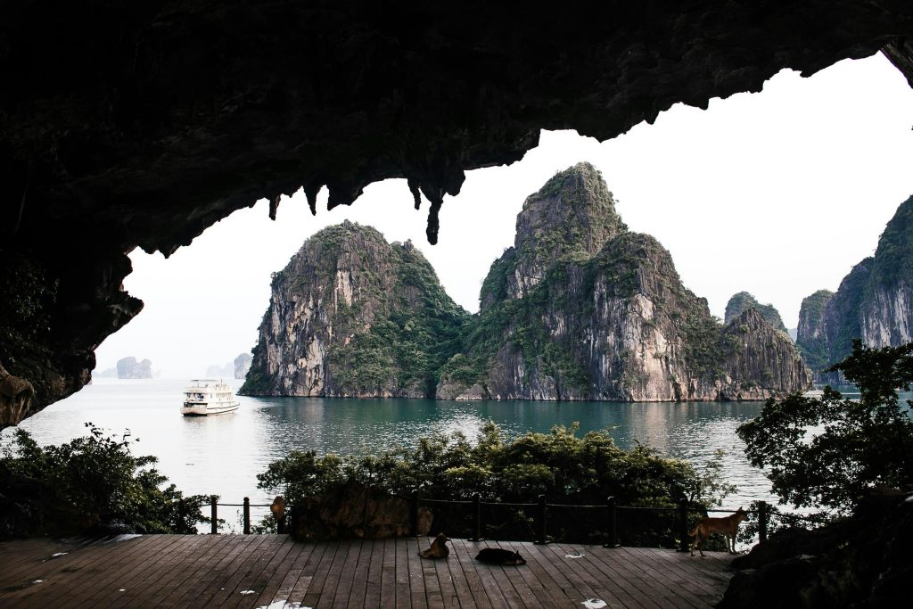 Stunning panoramic view of Ha Long Bay's famous limestone karsts from a cave.